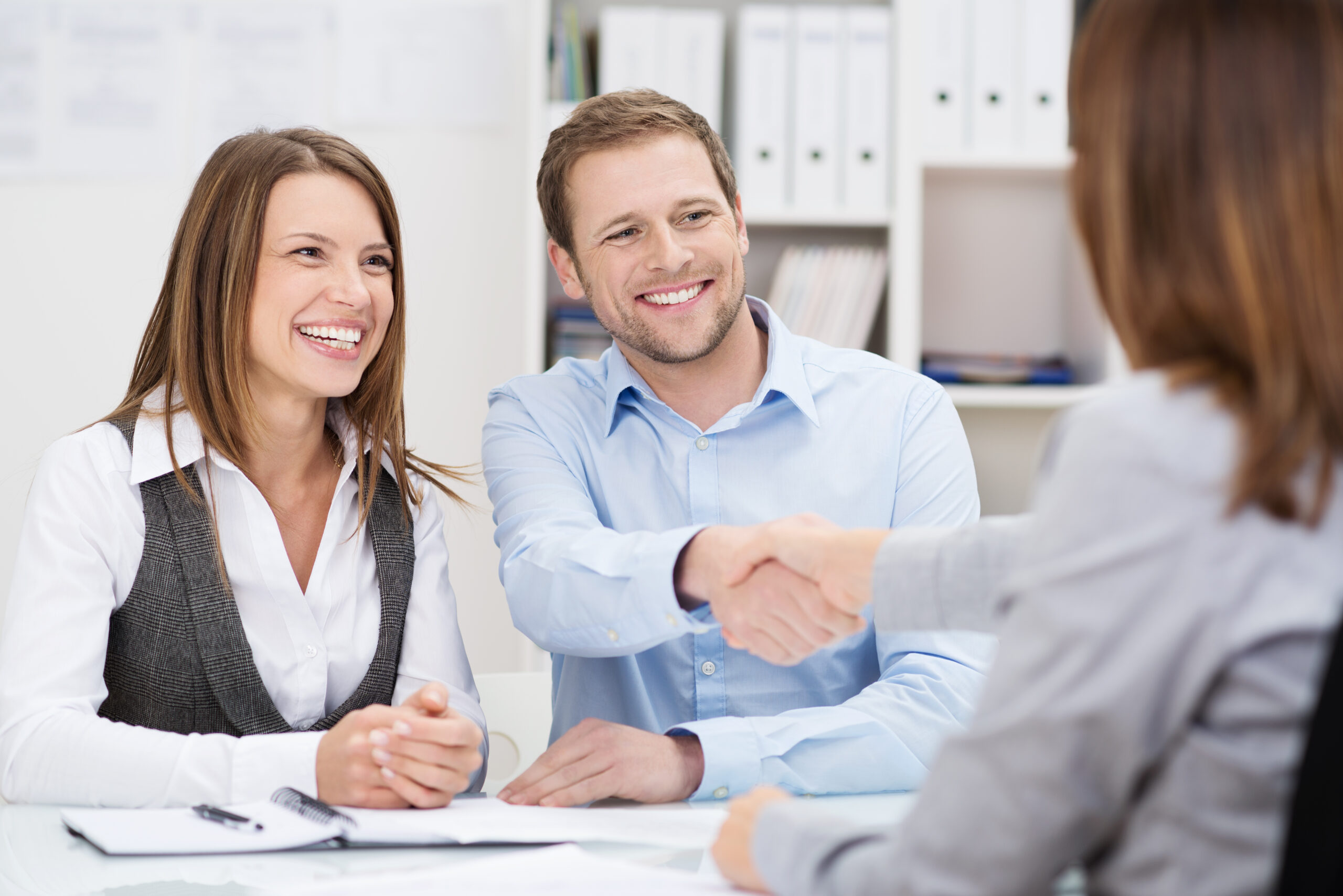 Smiling,Young,Man,Shaking,Hands,With,An,Insurance,Agent,Or